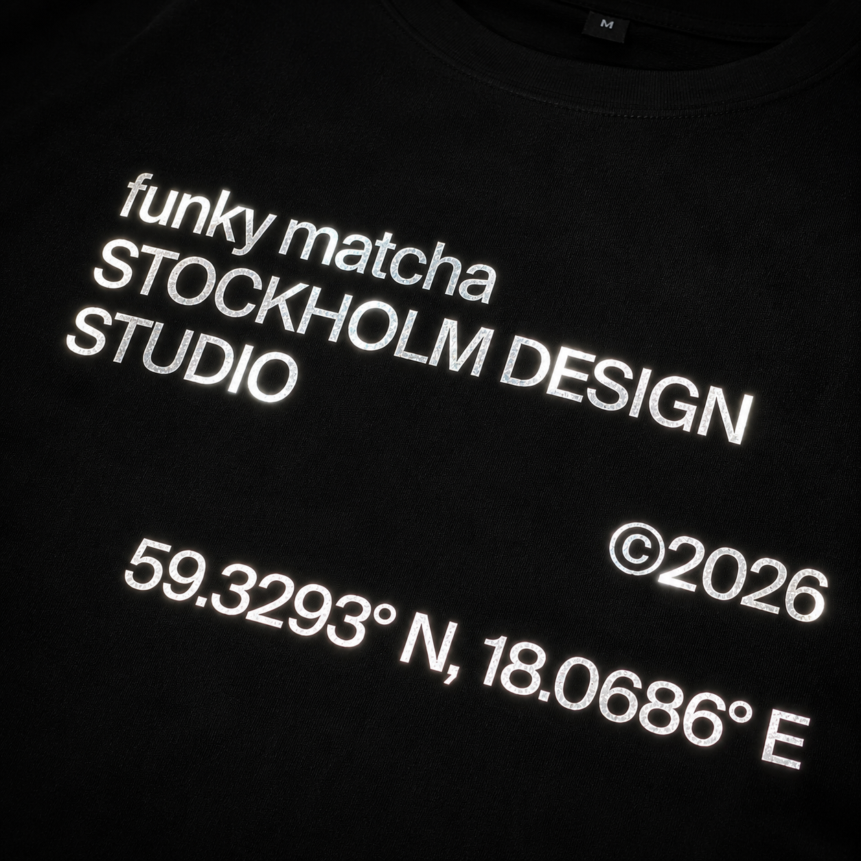 funky matcha stockholm black tee closeup
